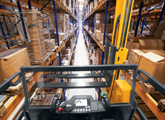 First-person view looking at warehouse aisle from turret of Jungheinrich truck